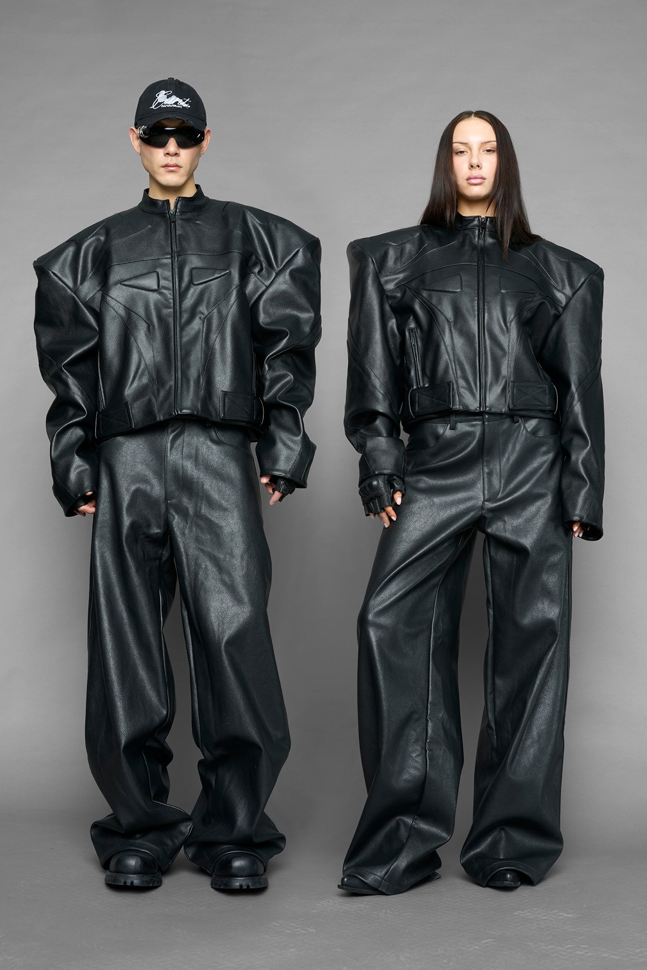black power shoulder moto jacket with extreme sculpted shoulders and integrated boning construction worn by models studio ecommerce image
