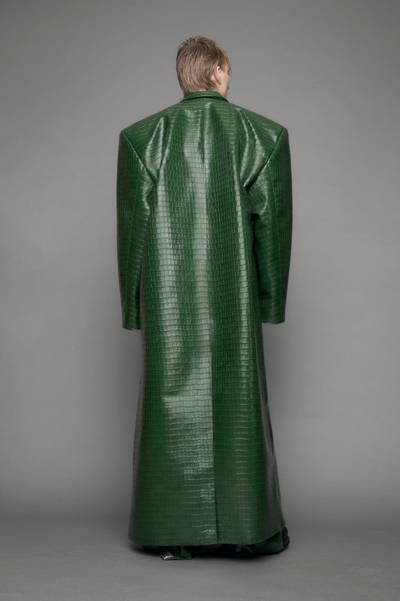 model wearing green vegan leather croc blazer coat