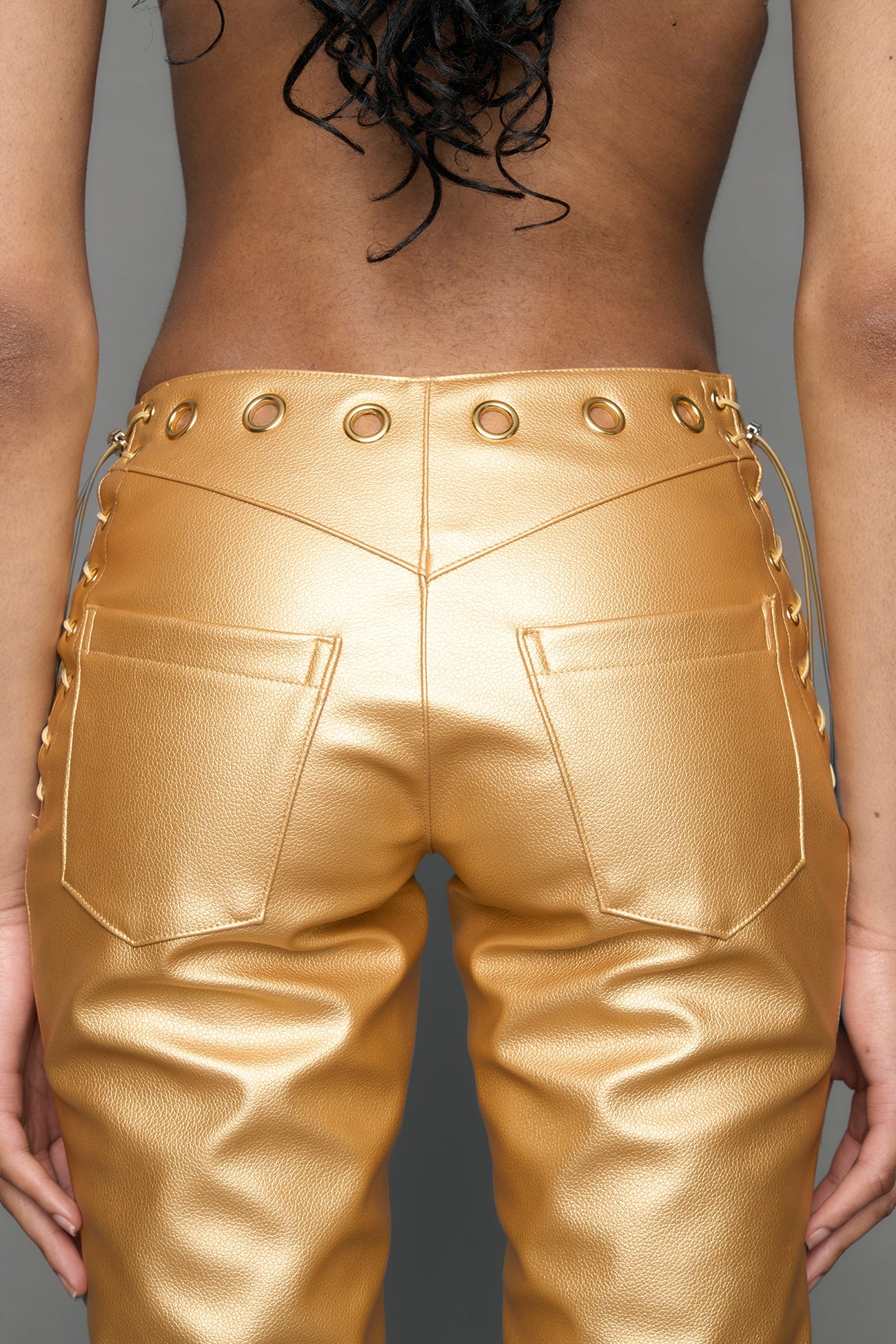 gold vegan leather pants with cuts