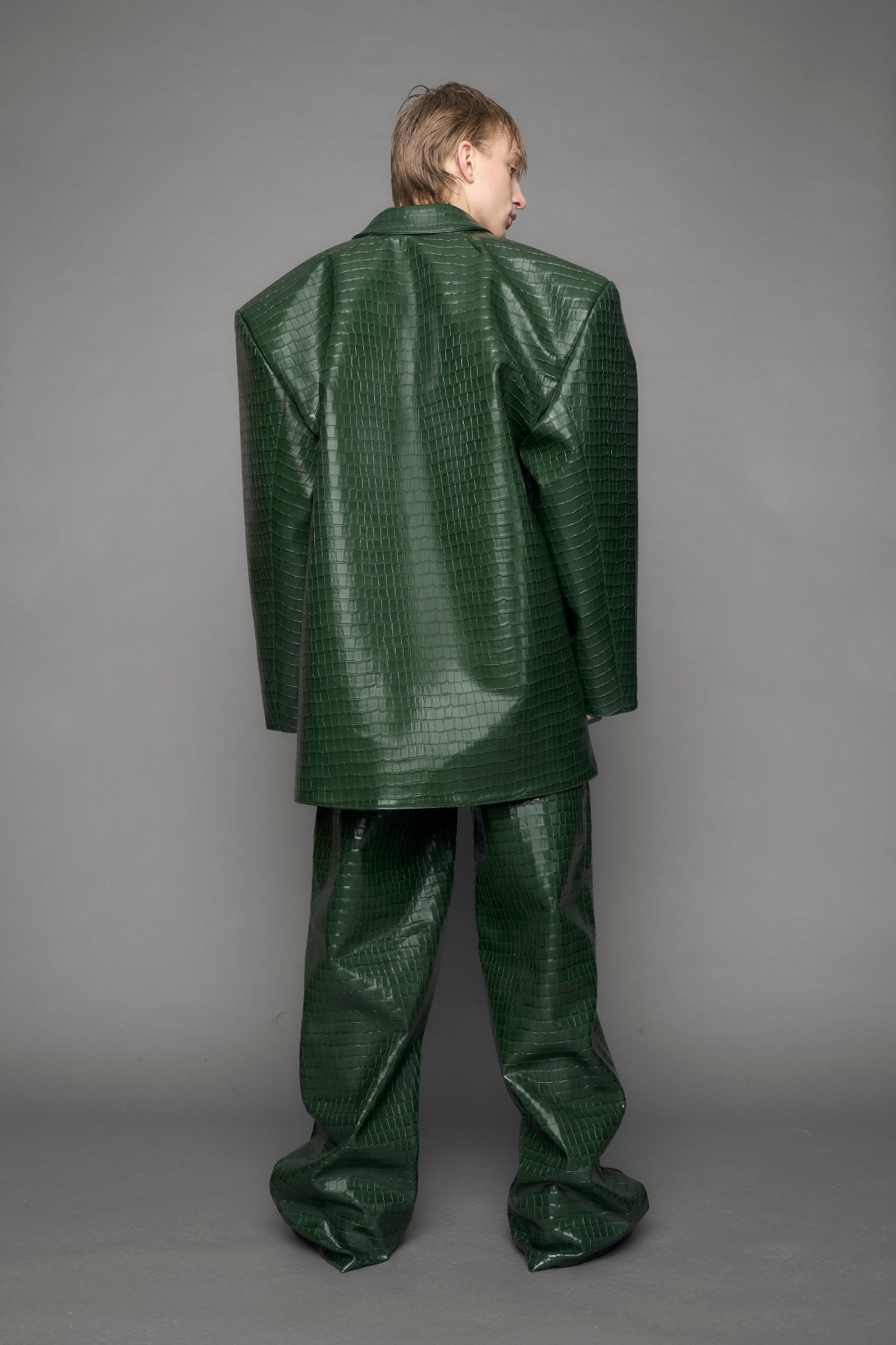 model wearing green vegan leather croc blazer