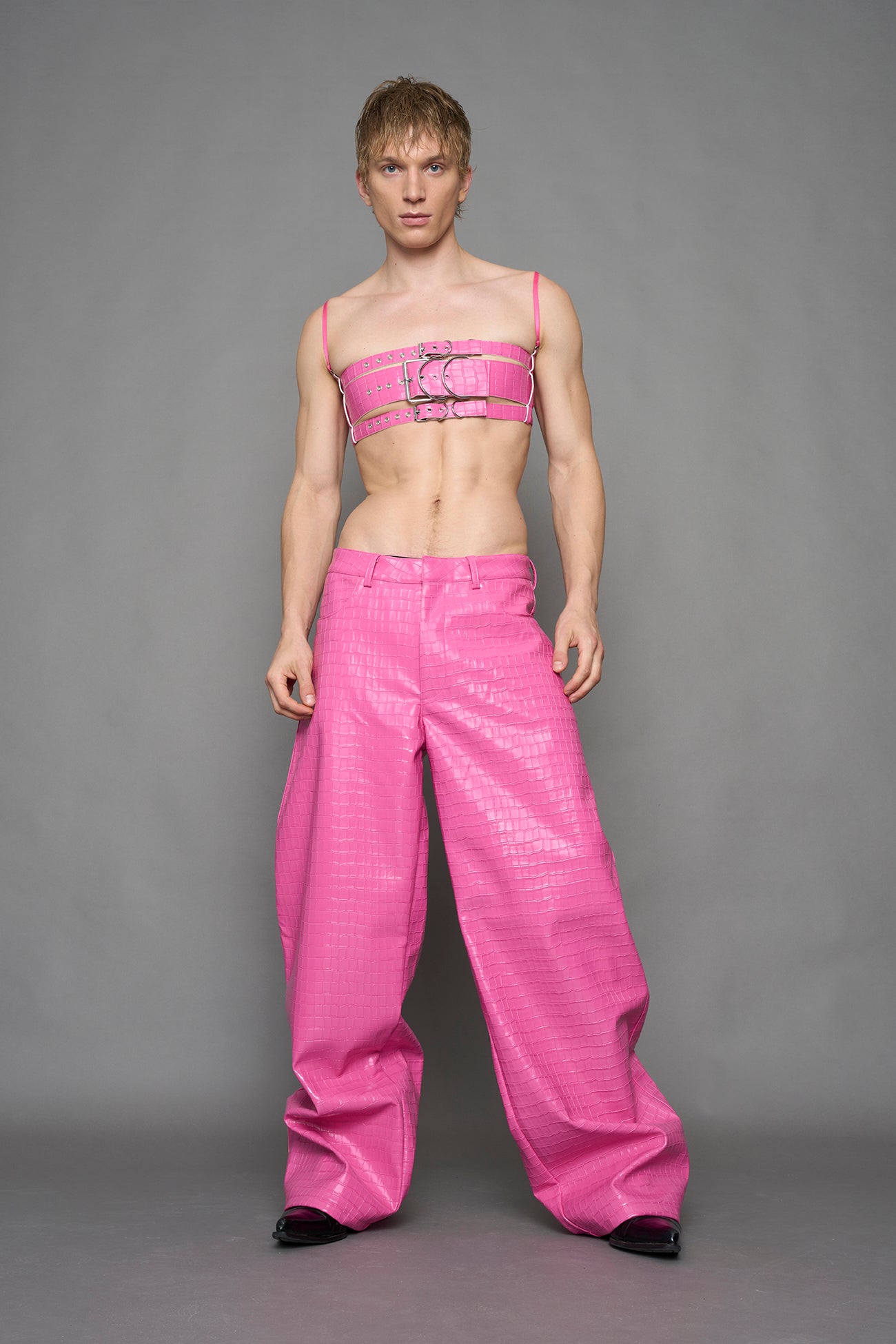 model wearing pink vegan leather croc baggy pants