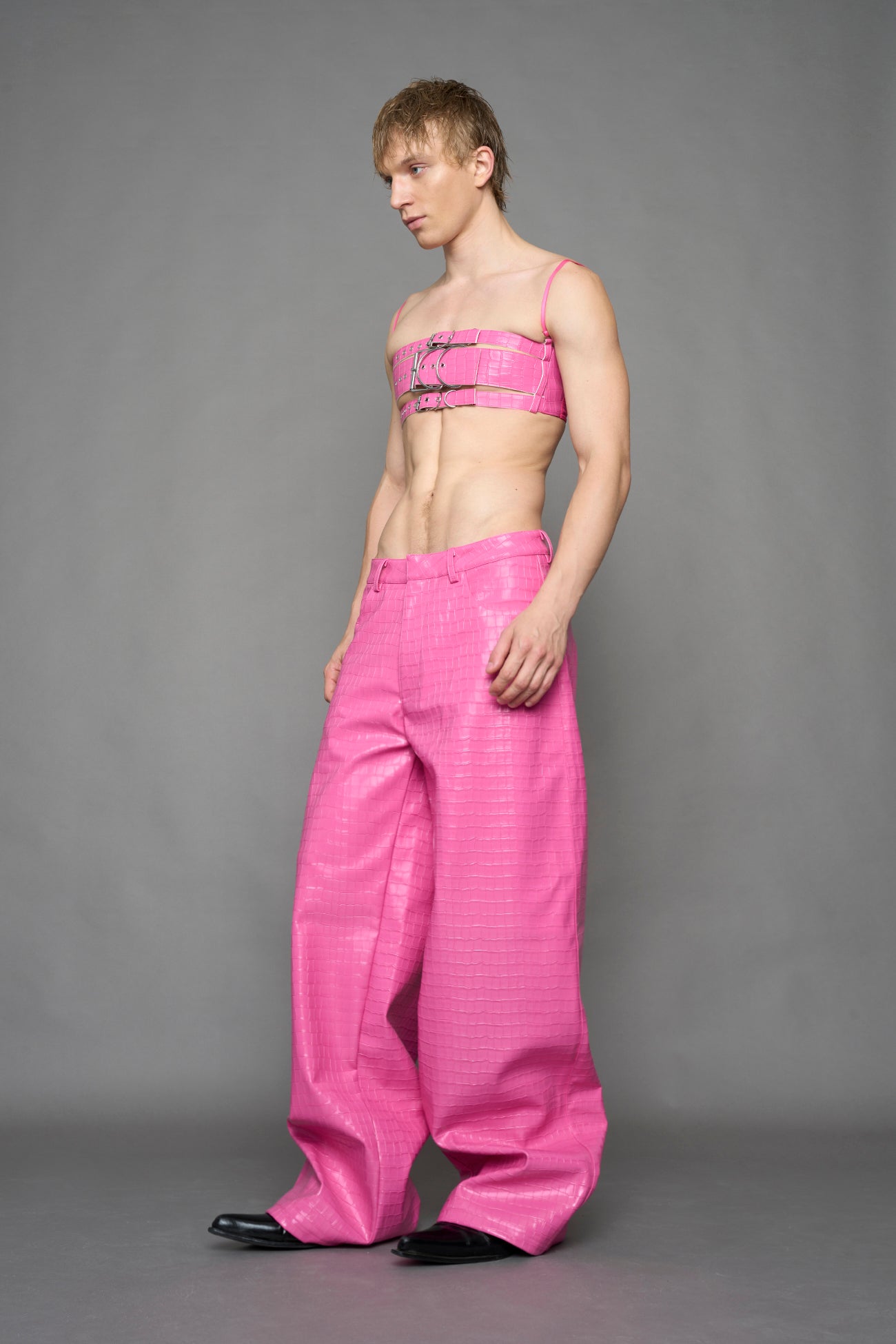 model wearing pink vegan leather croc baggy pants