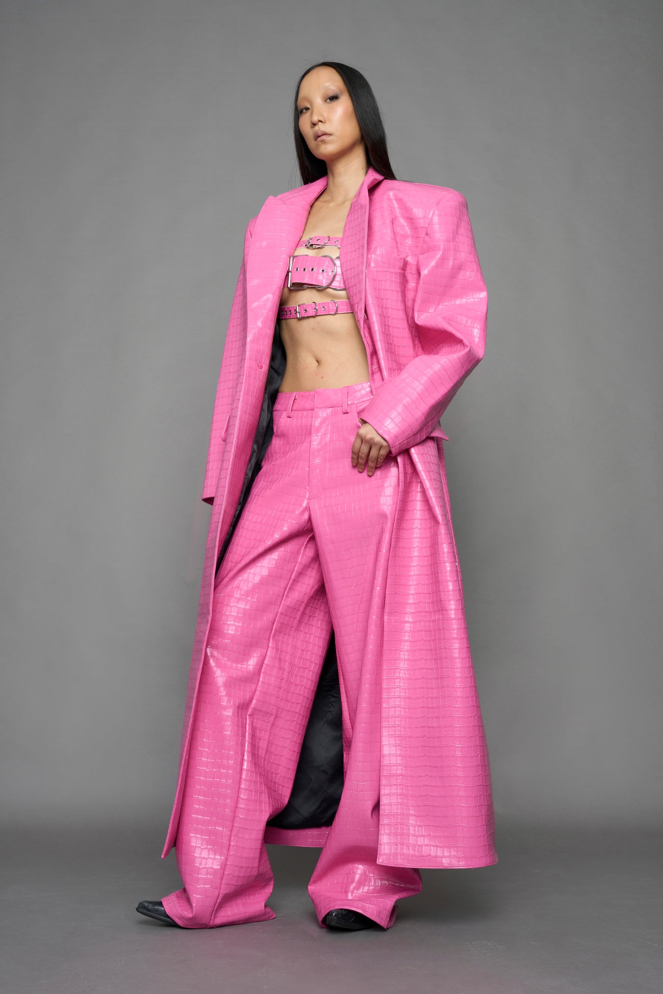 model wearing pink vegan croc leather long blazer coat