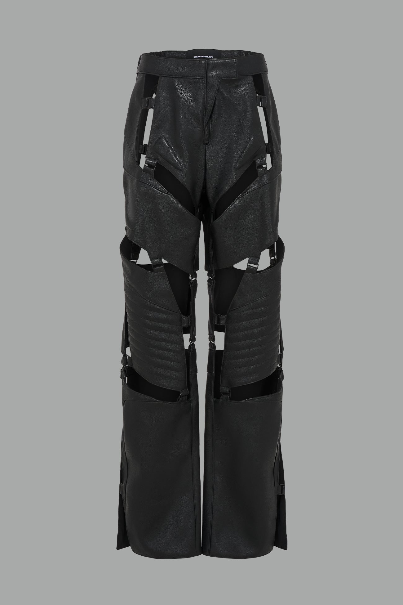 black vegan leather motocross-inspired pants with thigh cut-outs, strap harness details, quilted knee padding