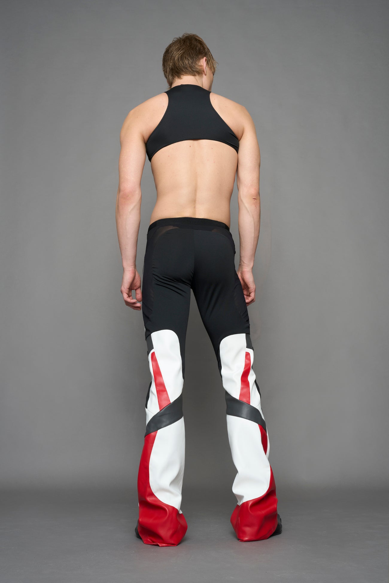 model wearing red white black moto inspired cut out body