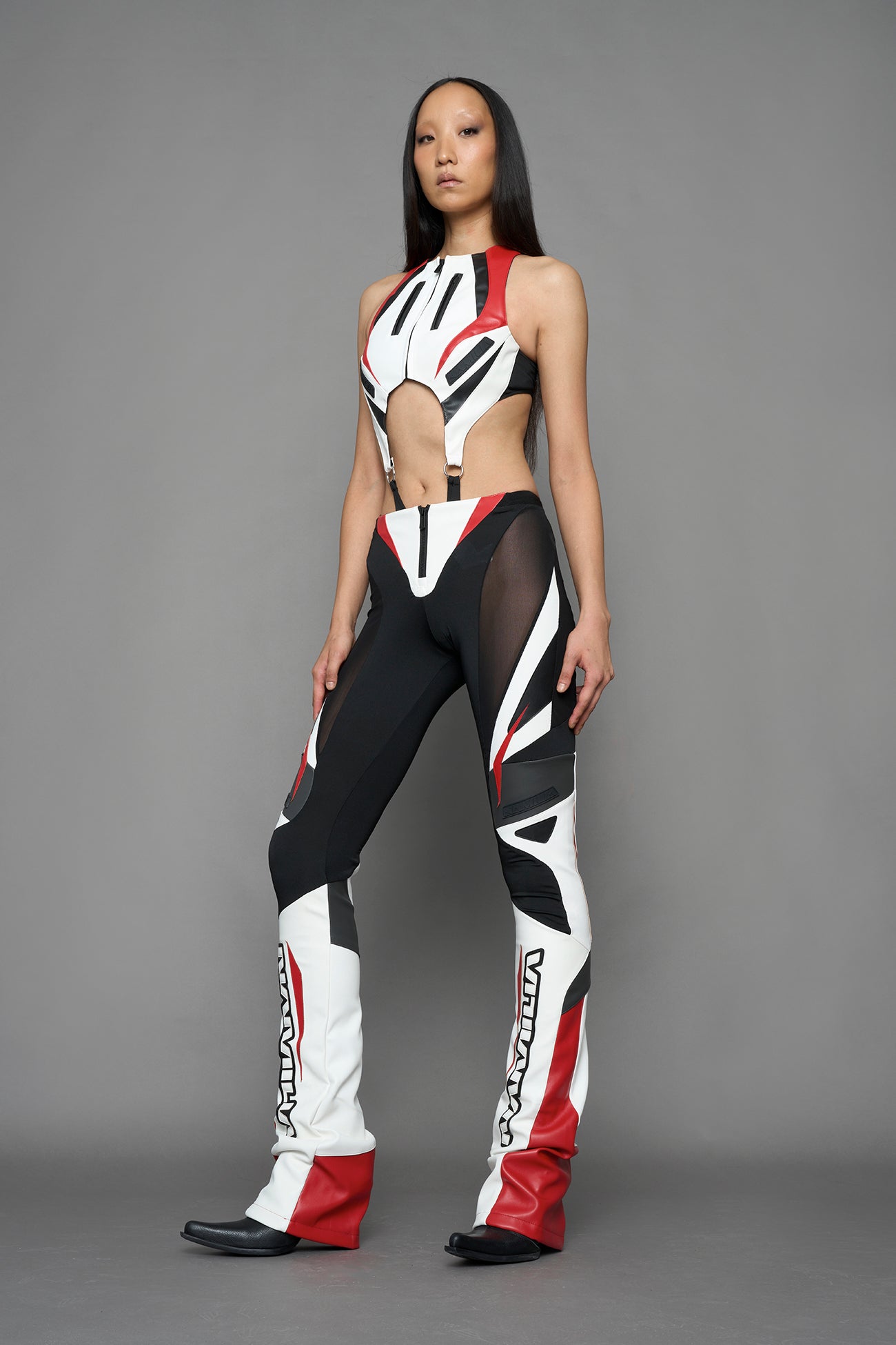 model wearing red white black moto inspired cut out body