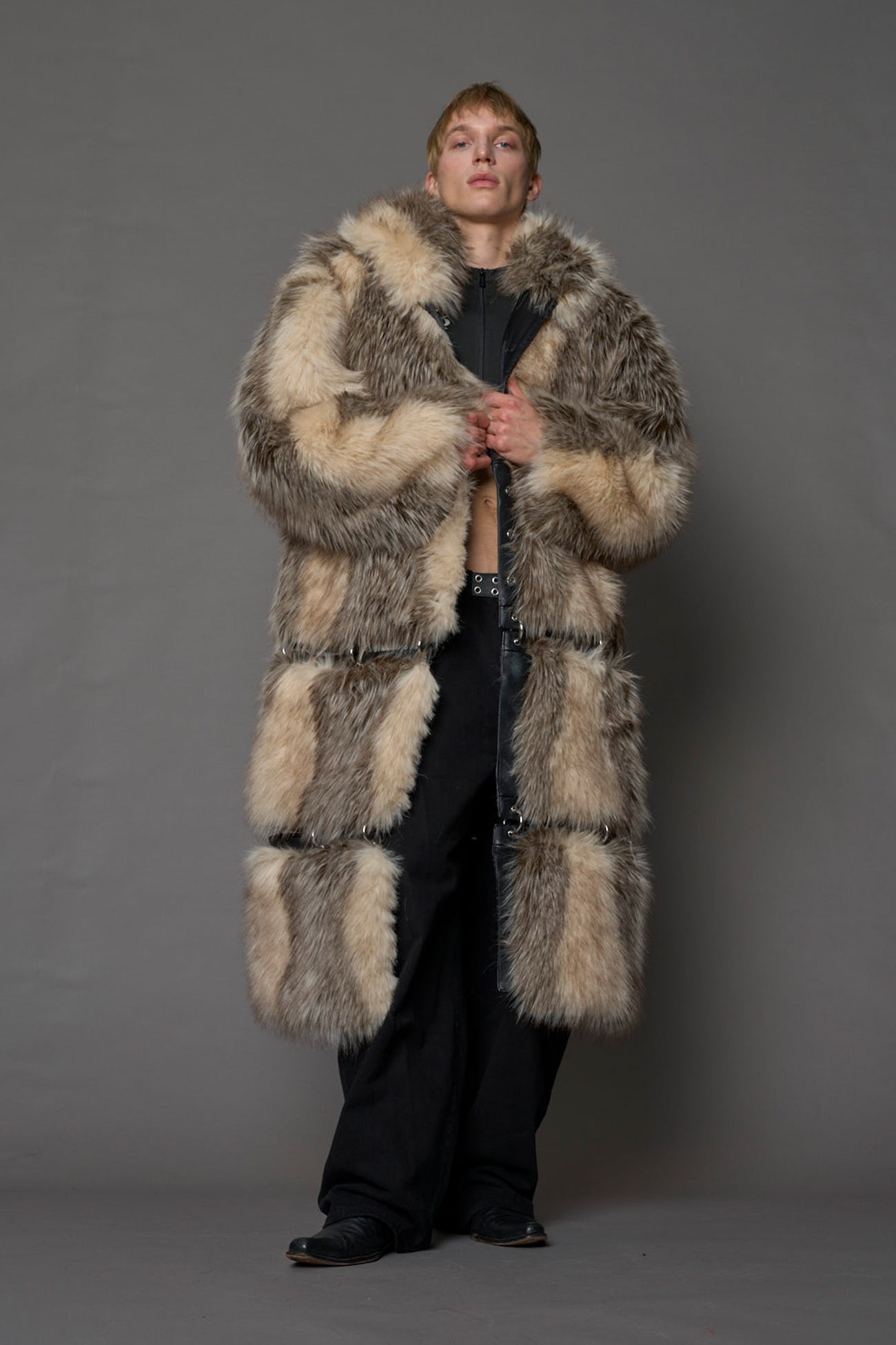 model wearing brown faux fur coat with silver metal rings