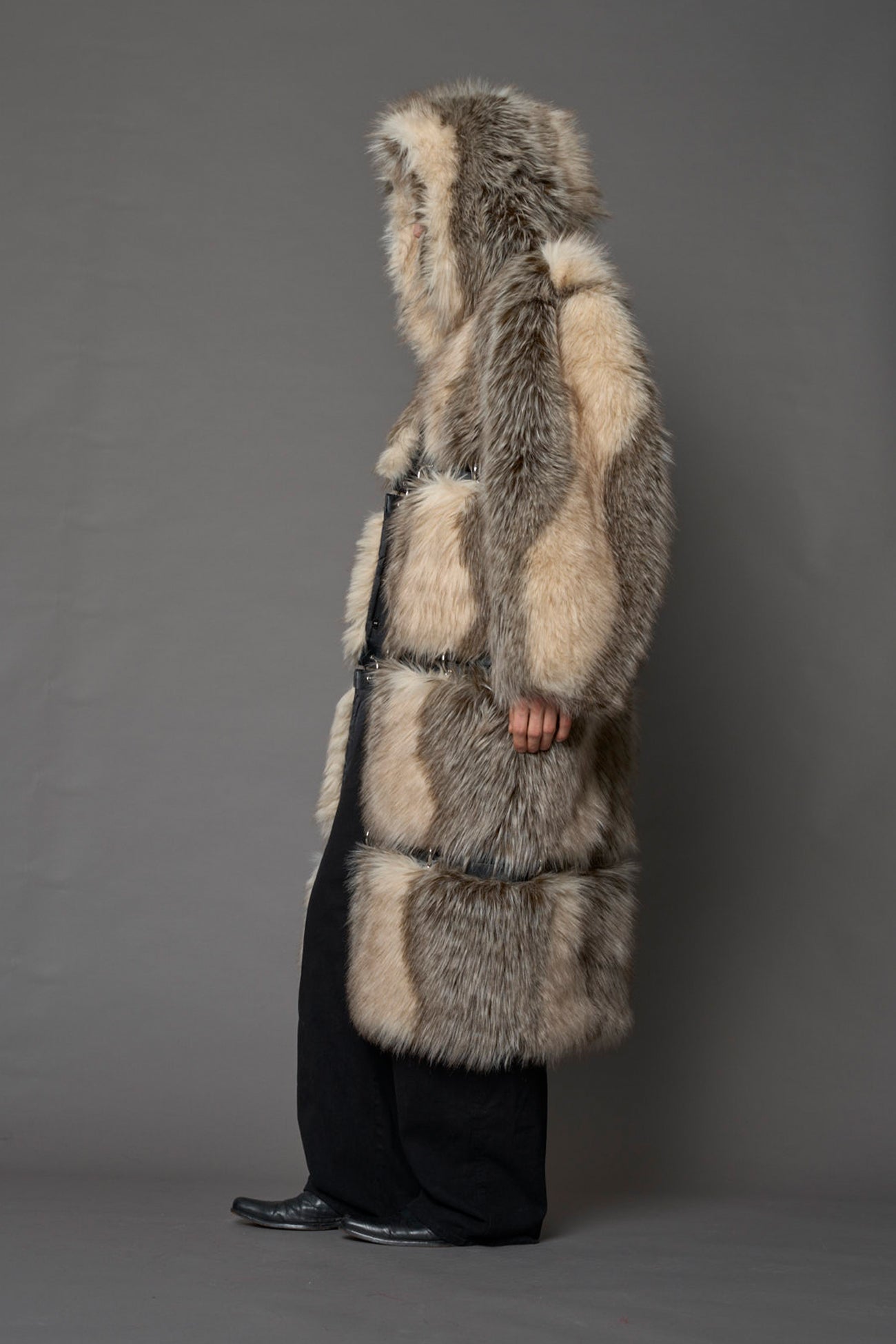 model wearing brown faux fur coat with silver metal rings