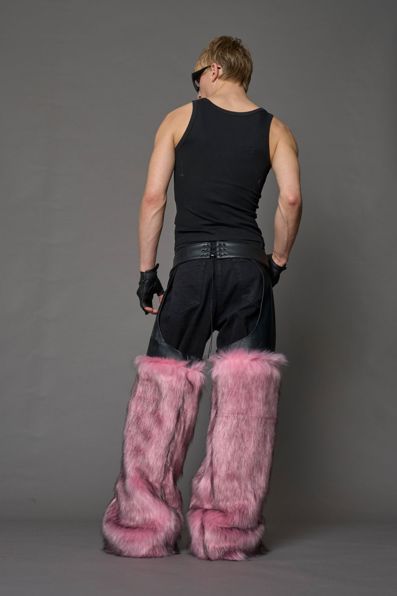 model wearing pink vegan leather and faux fur chaps