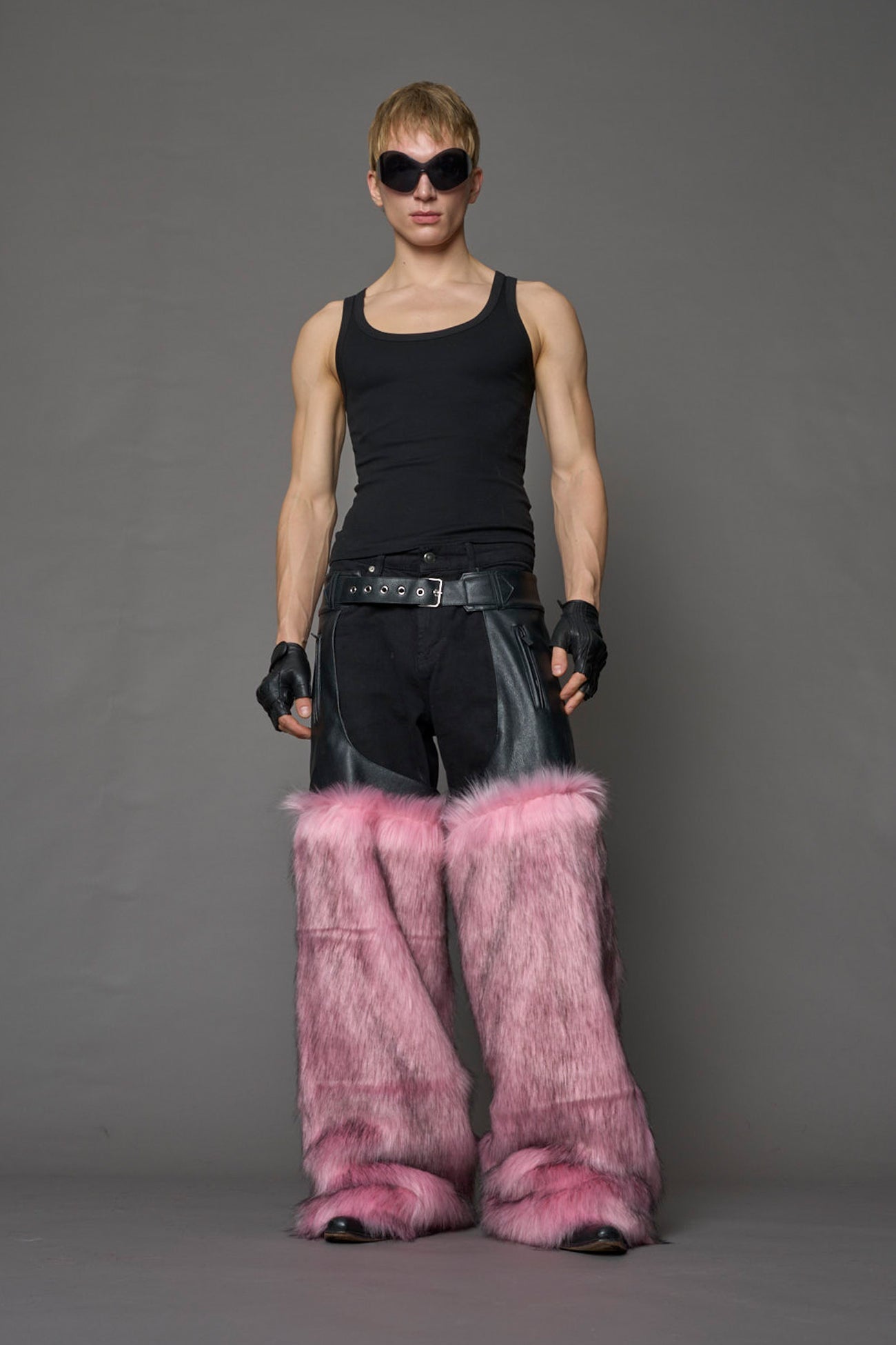 model wearing pink vegan leather and faux fur chaps