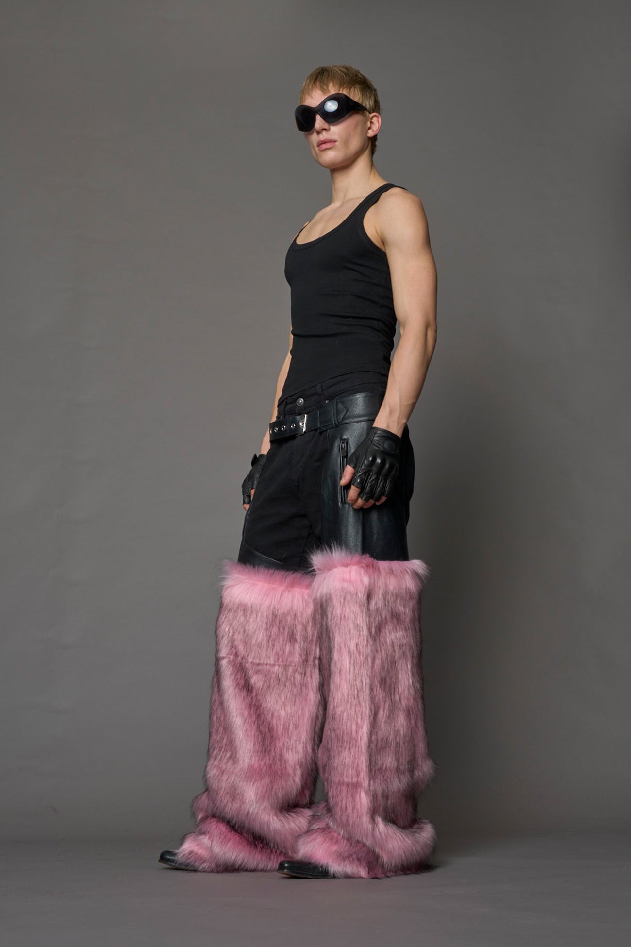 model wearing pink vegan leather and faux fur chaps