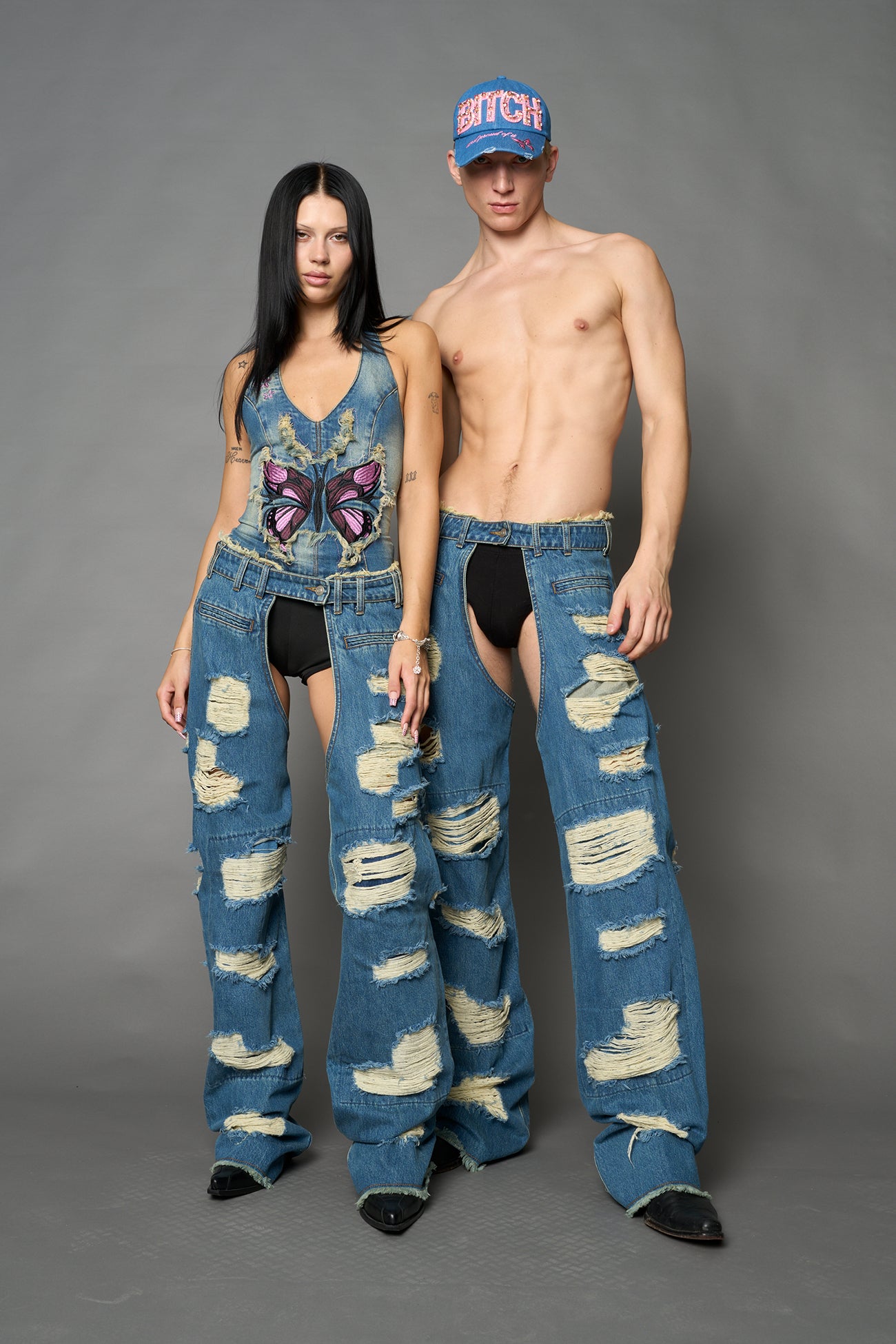 Namilia shredded blue denim chaps with low-rise fit, extreme thigh cut-outs and distressed straight legs