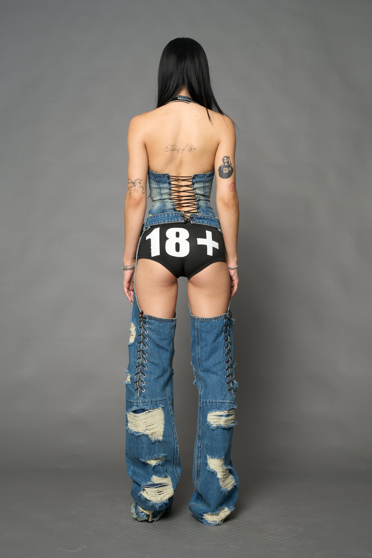 Namilia shredded blue denim chaps with low-rise fit, extreme thigh cut-outs and distressed straight legs