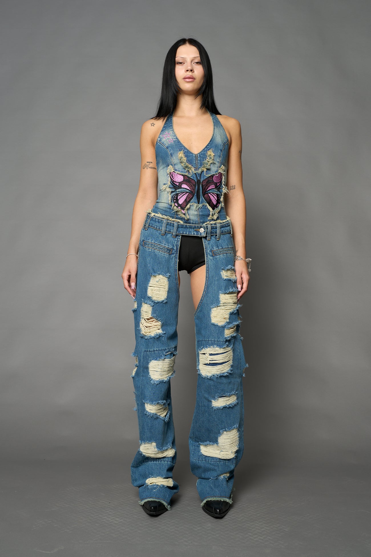 Namilia shredded blue denim chaps with low-rise fit, extreme thigh cut-outs and distressed straight legs