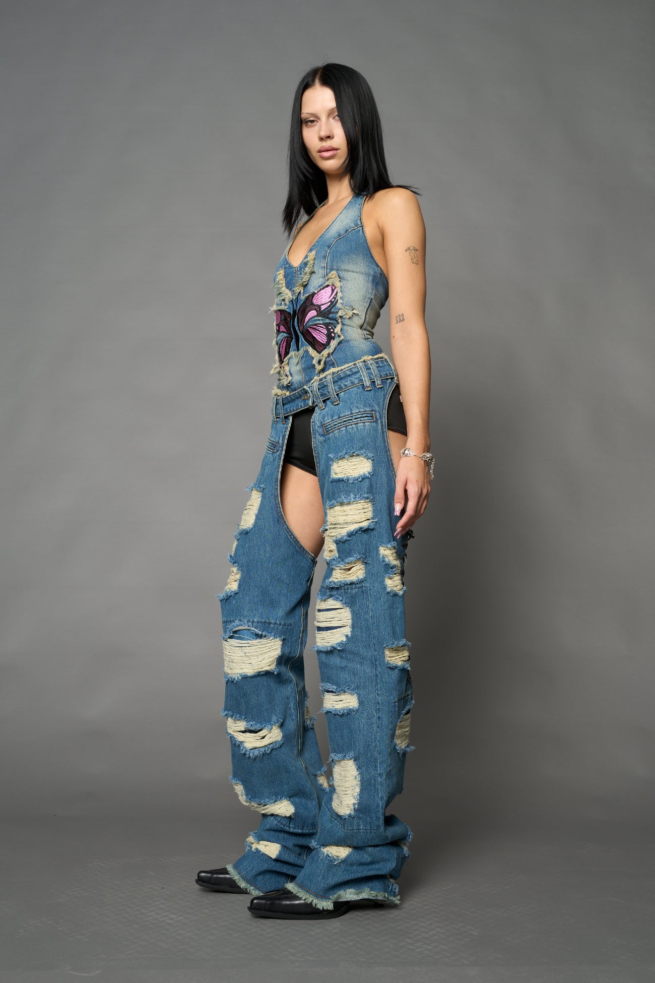 Namilia shredded blue denim chaps with low-rise fit, extreme thigh cut-outs and distressed straight legs
