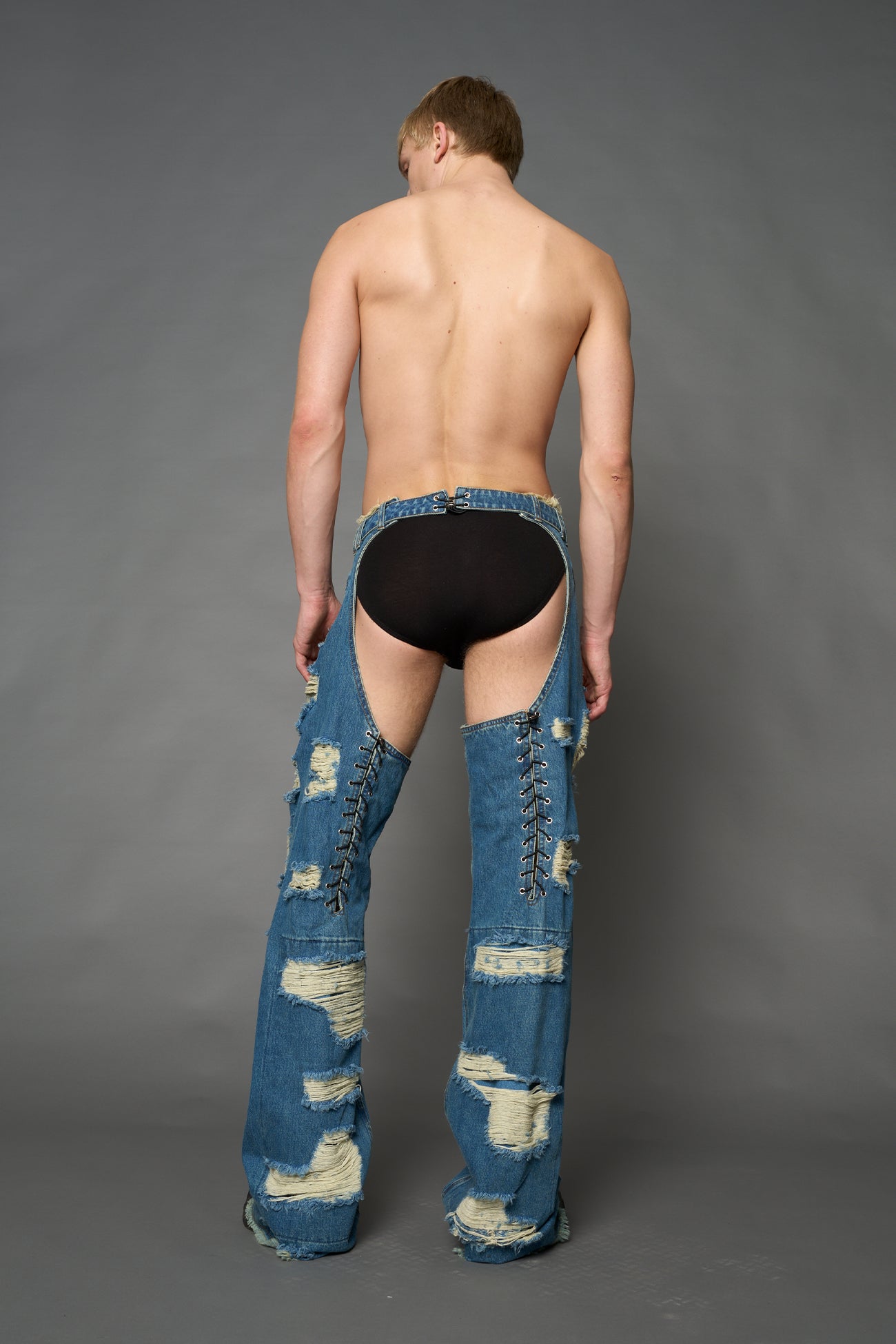 Namilia shredded blue denim chaps with low-rise fit, extreme thigh cut-outs and distressed straight legs