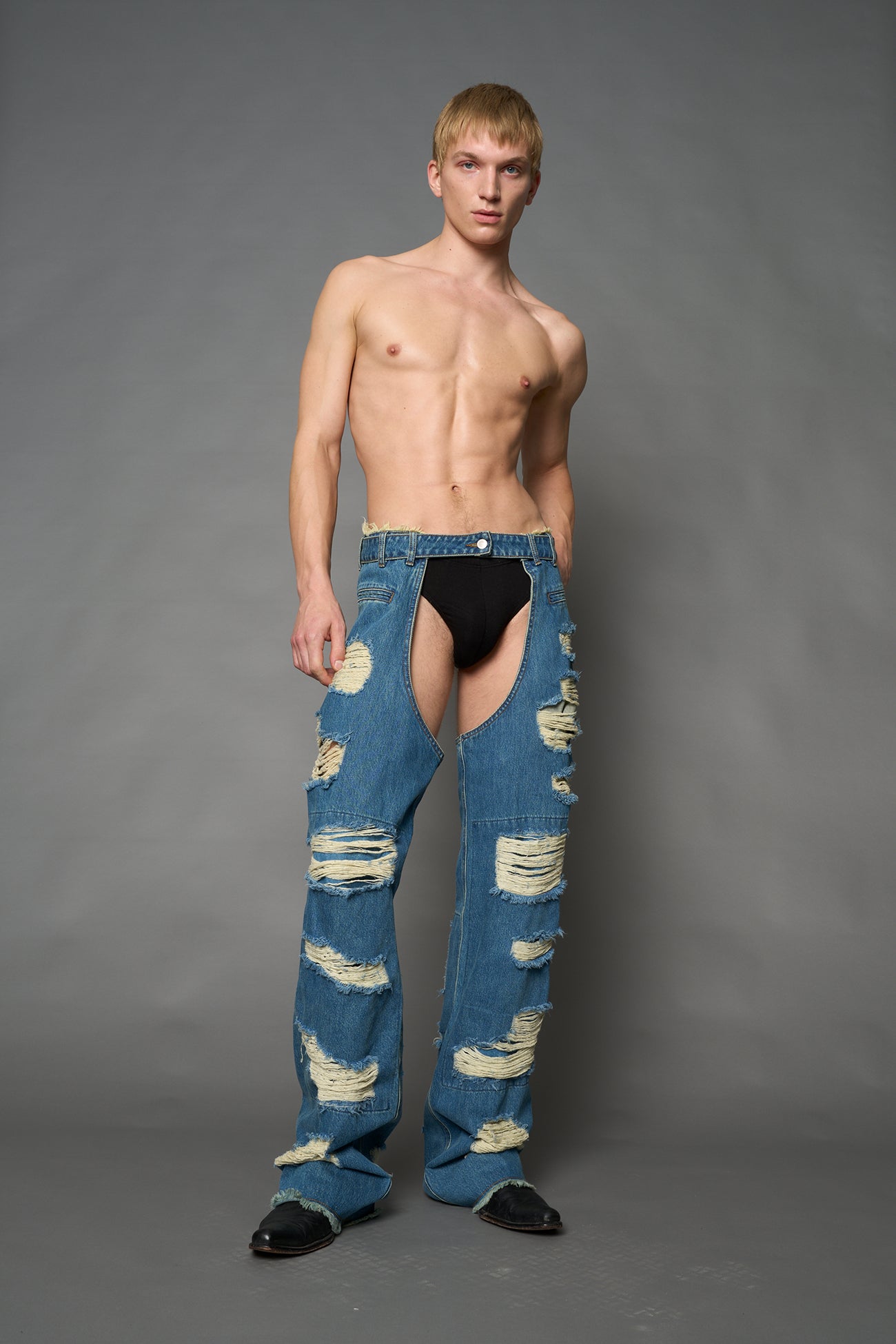 Namilia shredded blue denim chaps with low-rise fit, extreme thigh cut-outs and distressed straight legs