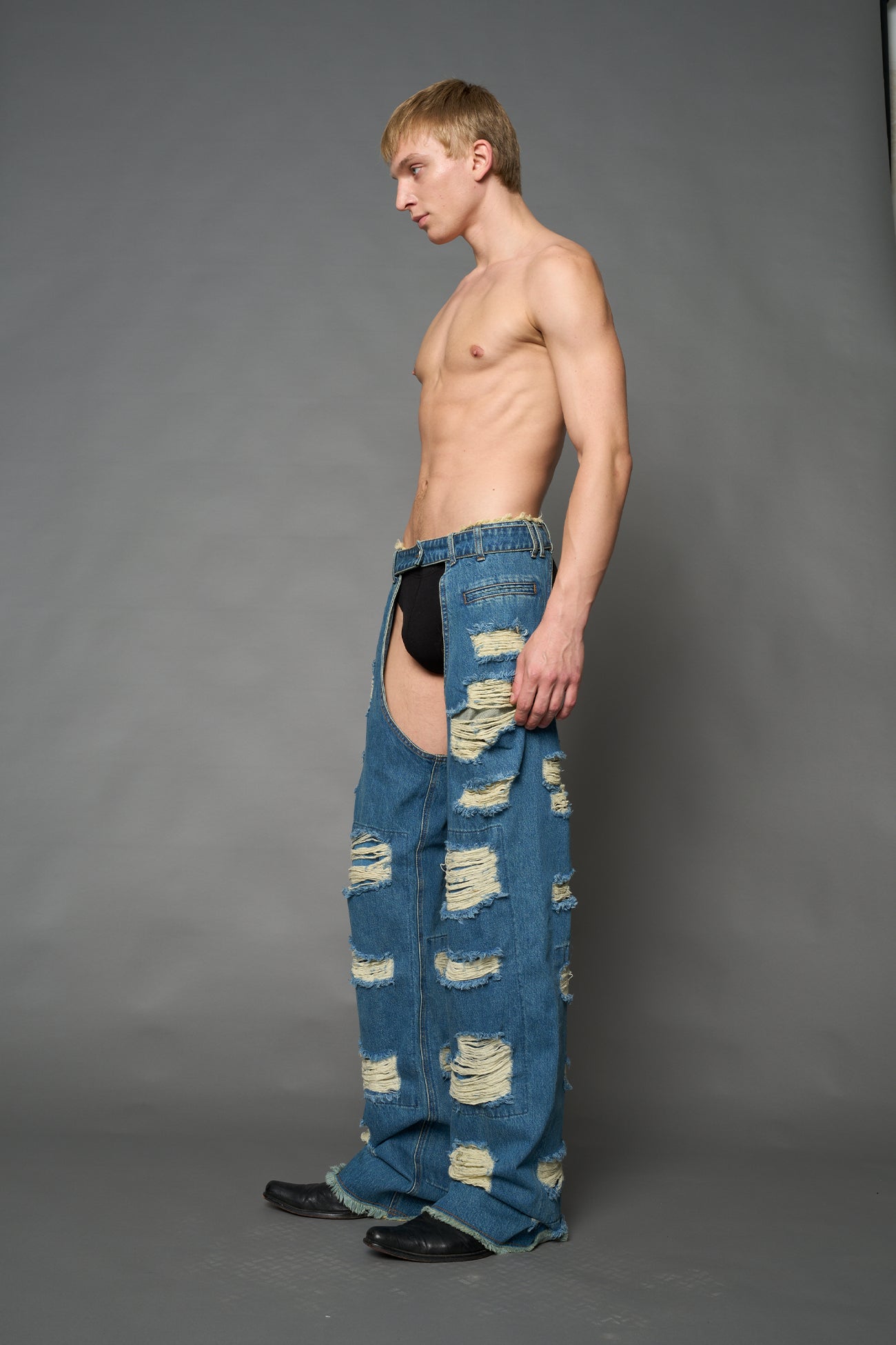 Namilia shredded blue denim chaps with low-rise fit, extreme thigh cut-outs and distressed straight legs