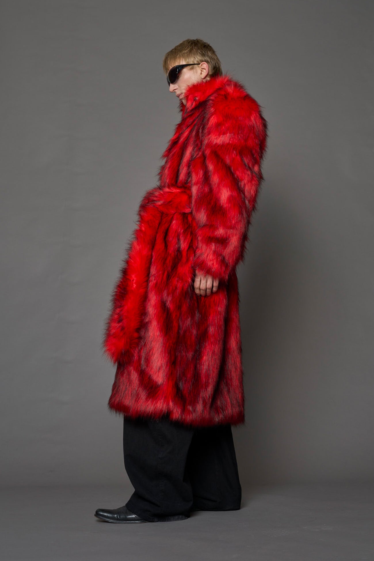 red faux fur coat with shoulder pads and belt