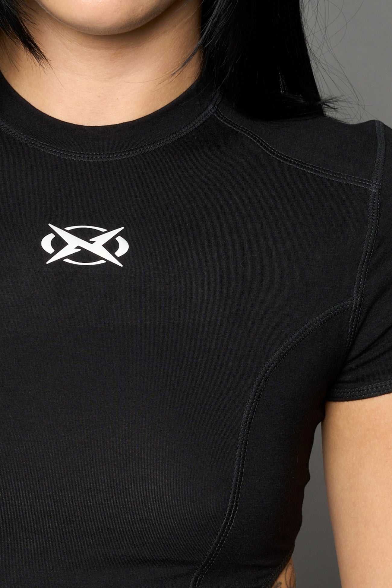 Black Namilia logo bodysuit with cut-out sides, high-cut leg and strap details