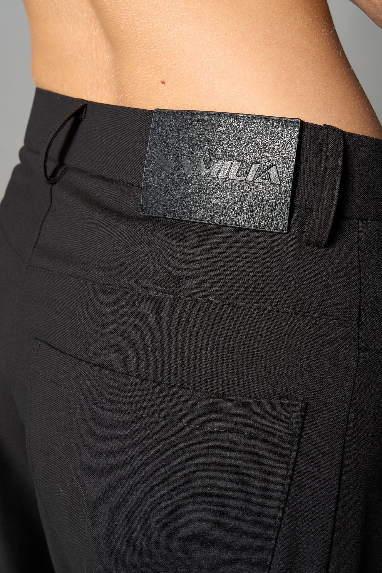 model wearing baggy wool suiting pants black