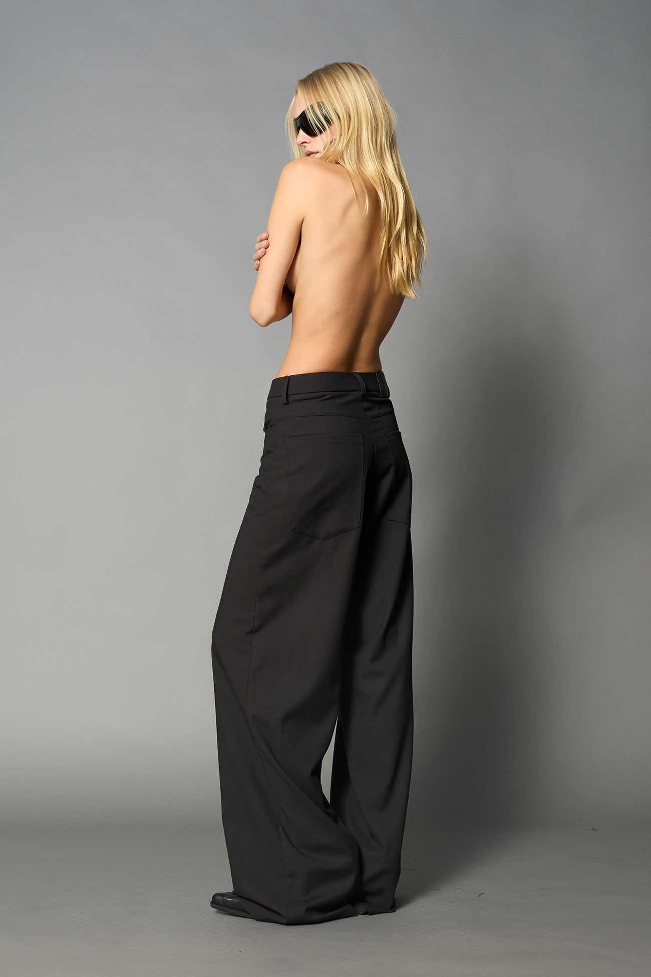 model wearing baggy wool suiting pants black