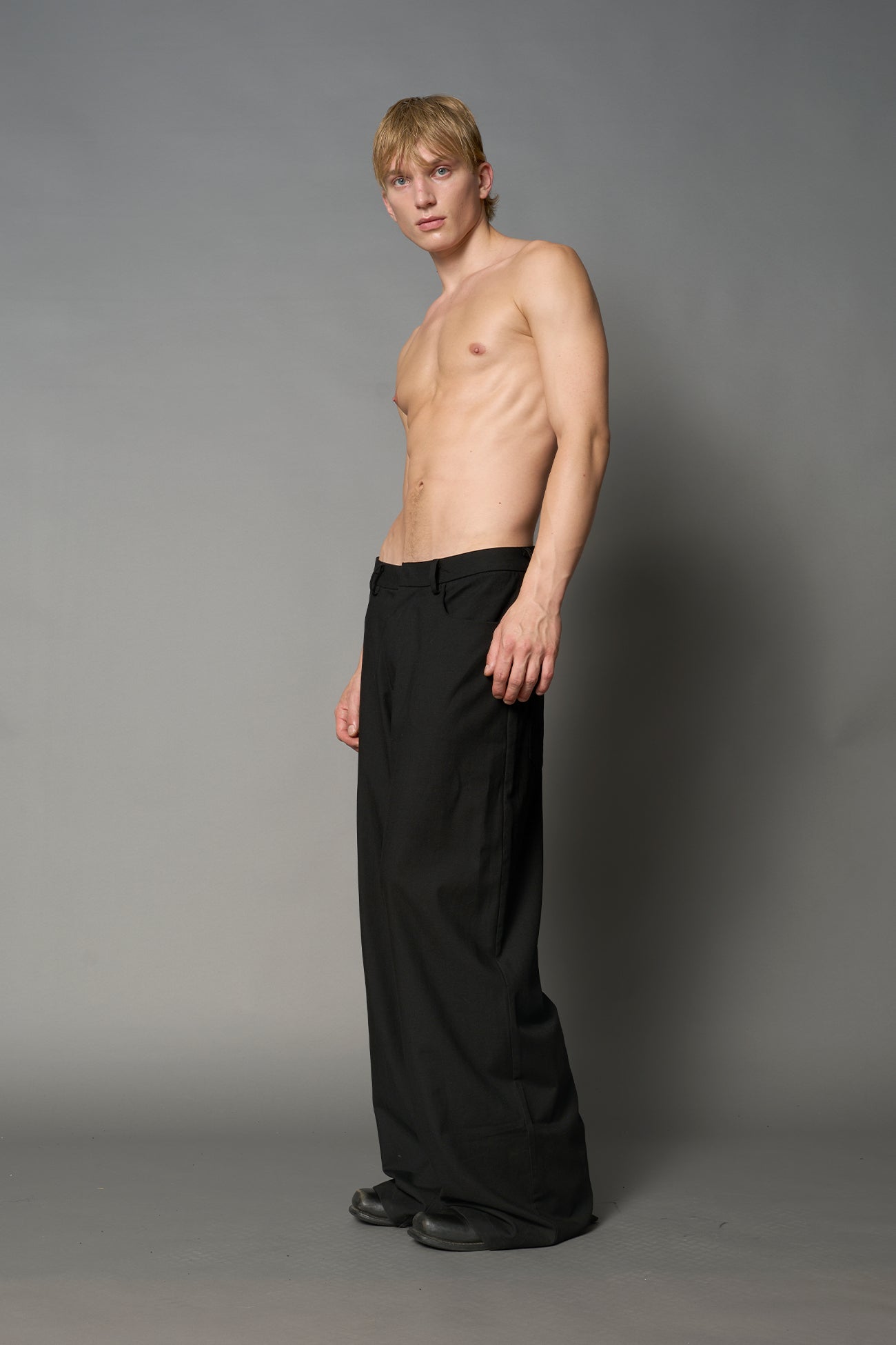 model wearing baggy wool suiting pants black