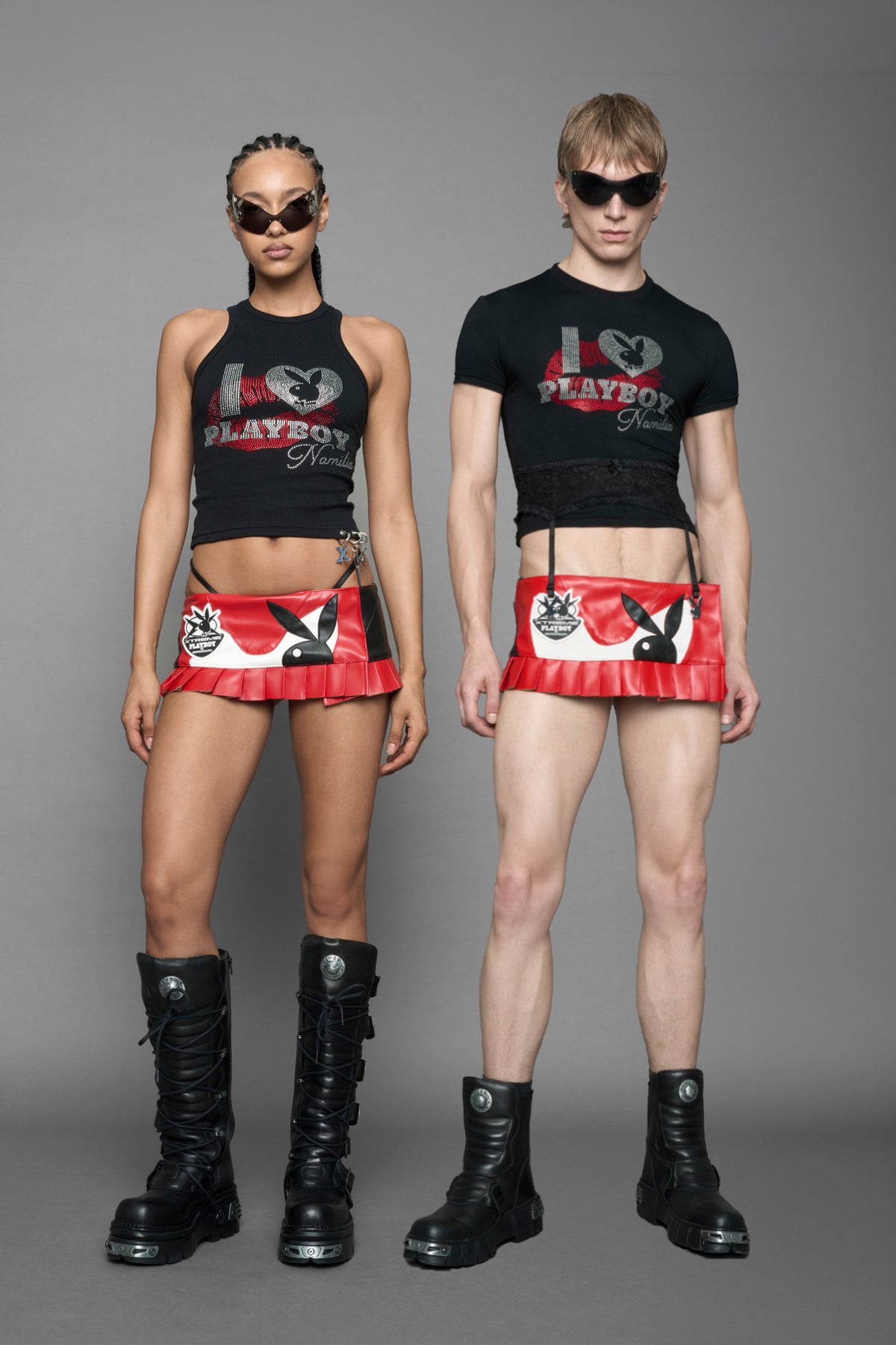 model wearing a red vegan leather wrap mini skirt with a black PU leather Bunny embroidery and a branded 'Playboy X Namilia' Rubbertag.