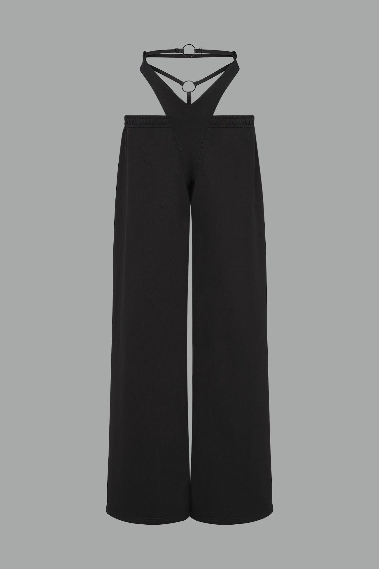 low-rise black wide-leg pants featuring a V-shaped waistband and detachable thong strap detail.