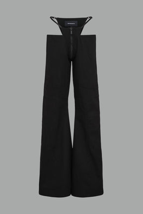 Low-rise flared pants in black cotton twill with bold side cut-outs and thong strap detailing.