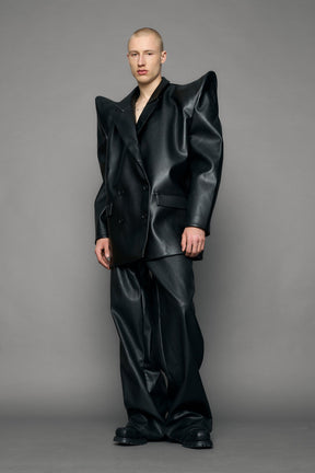 model wearing black pu leather blazer with sharp shoulder design