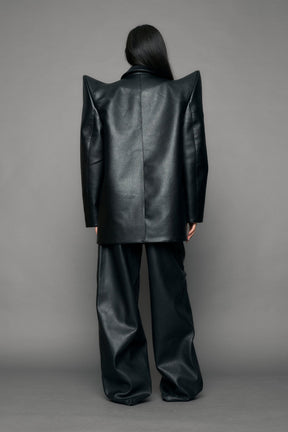 model wearing black pu leather blazer with sharp shoulder design