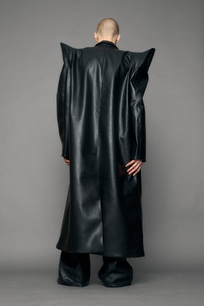 model wearing black pu leather coat with sharp shoulder design