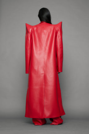 model wearing red pu leather coat with sharp shoulder design