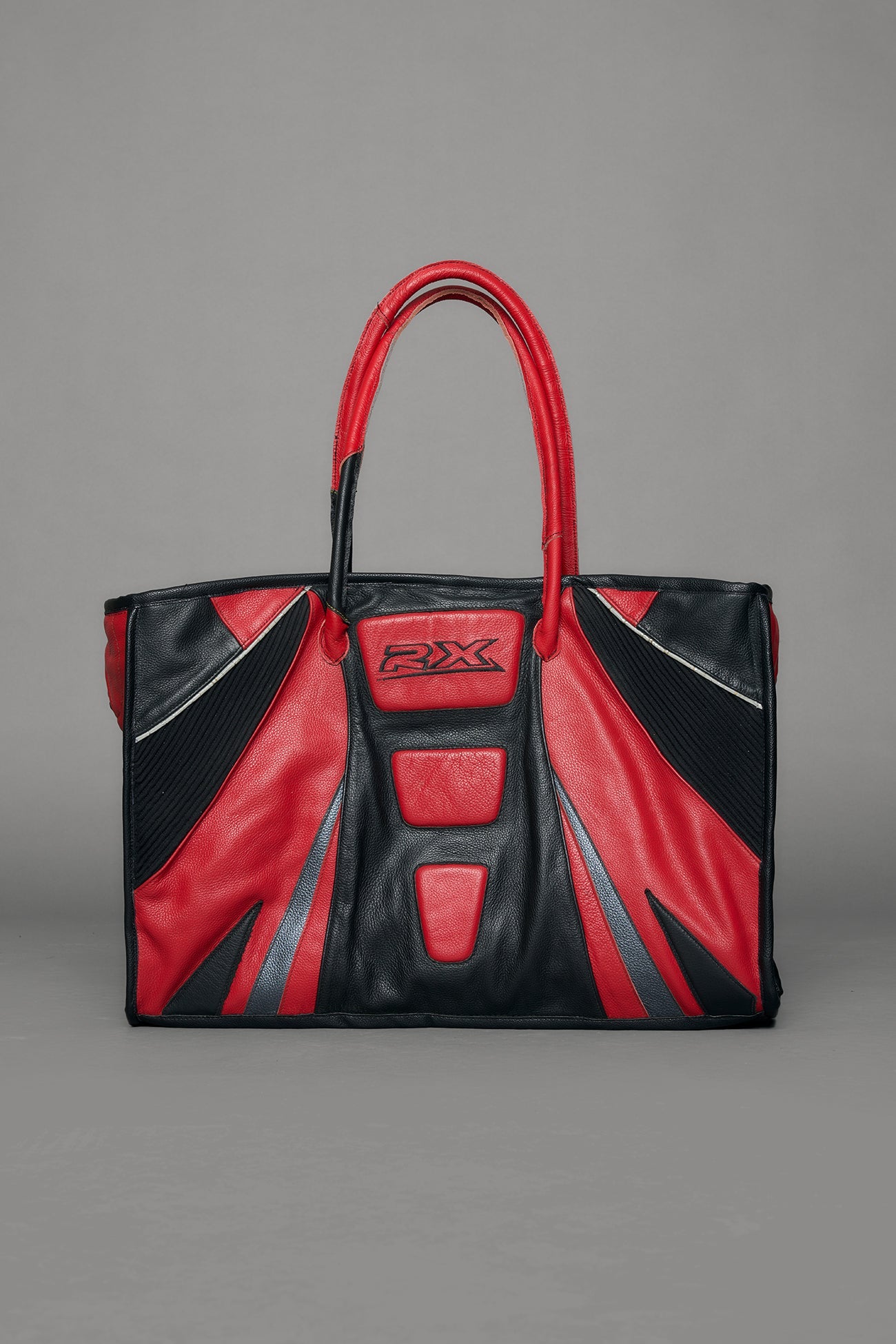 Black and red bag with reflective accents on a gray background