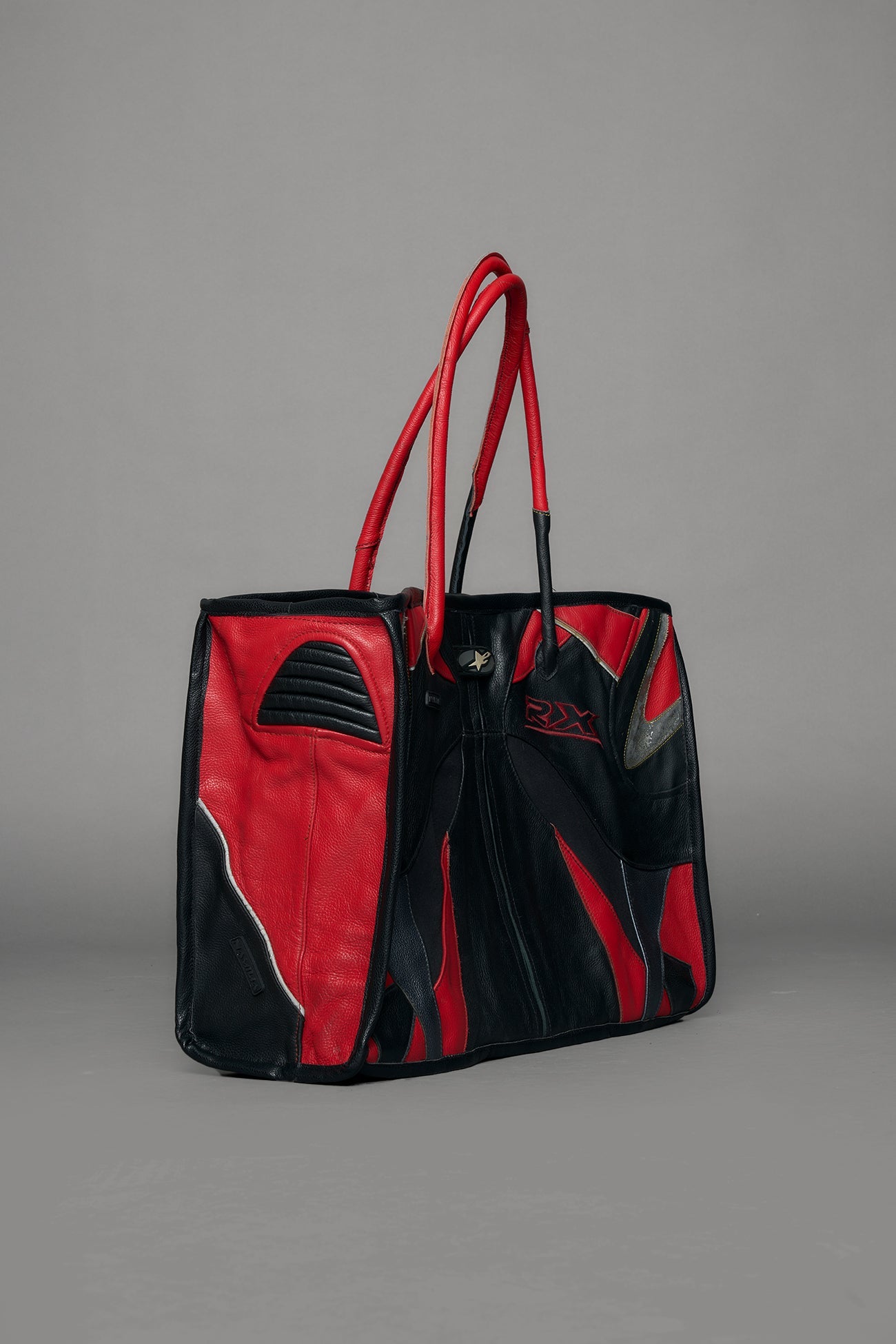Black and red bag with reflective accents on a gray background