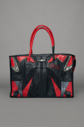 Black and red bag with reflective accents on a gray background