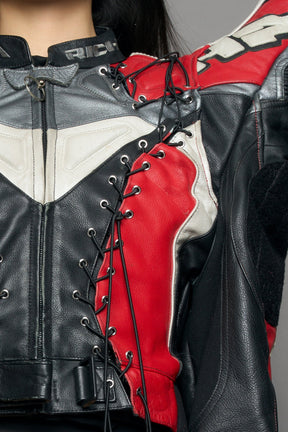model wearing a motocross jacket with red and black accents on a gray background