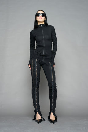 black hook and eye zip up jacket in soft jersey fabric with fitted silhouette worn by model studio ecommerce image