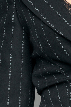 model wearing black pinstripe draped blazer black