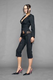 model wearing capri pinstripe pants black with garter design