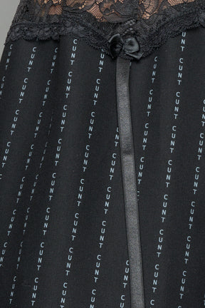 model wearing black print baggy suiting pants with garter lace waist detail