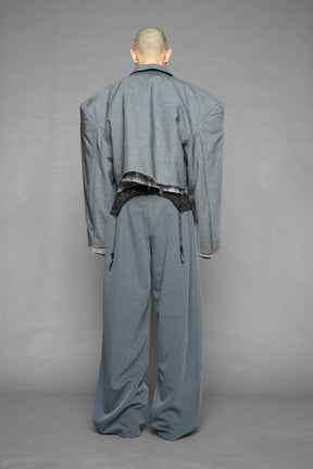 model wearing grey print baggy suiting pants with garter lace waist detail