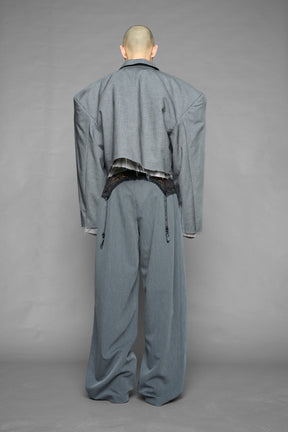 model wearing grey print baggy suiting pants with garter lace waist detail