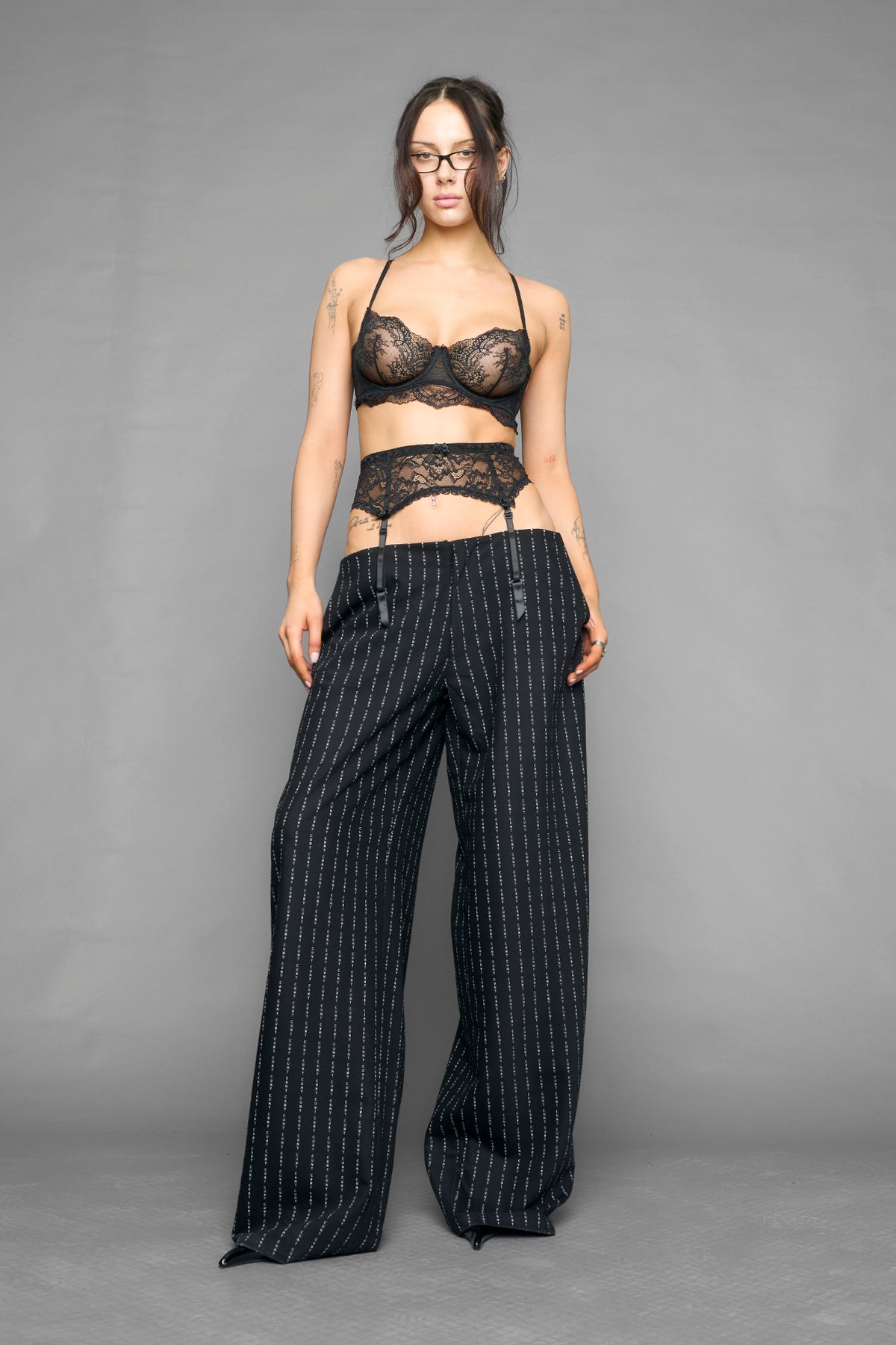 model wearing suspender lace office baggy pants in wool blend
