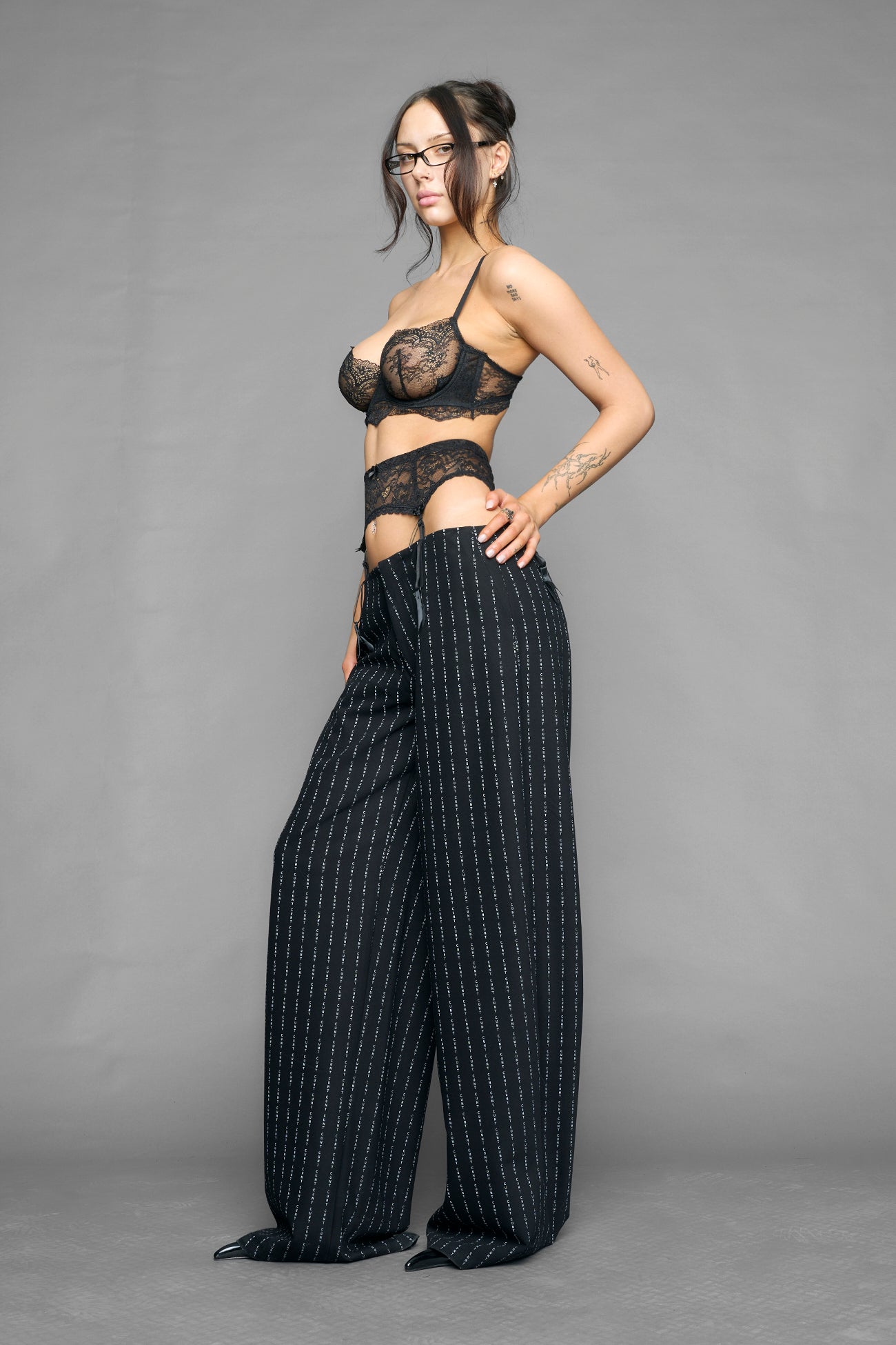 model wearing suspender lace office baggy pants in wool blend
