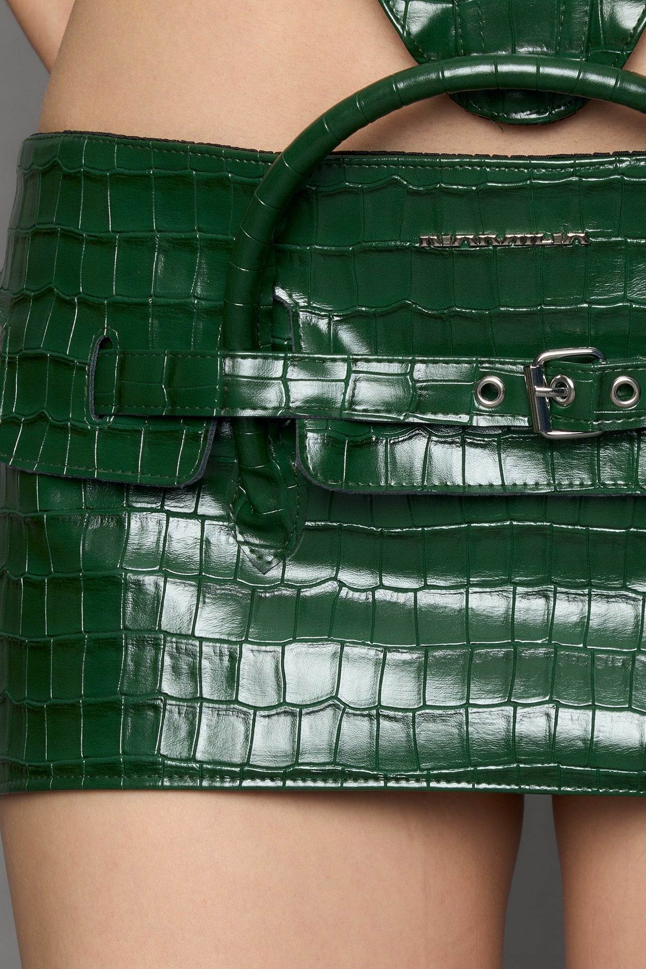 model wearing green croc pu leather handbag skirt