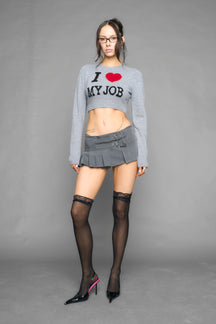 model wearing intarsia knit wool sweater cropped length grey