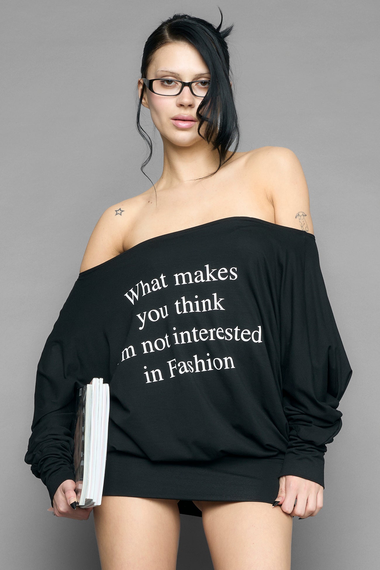 black off shoulder mini dress with long sleeves and statement text print worn by model studio ecommerce image