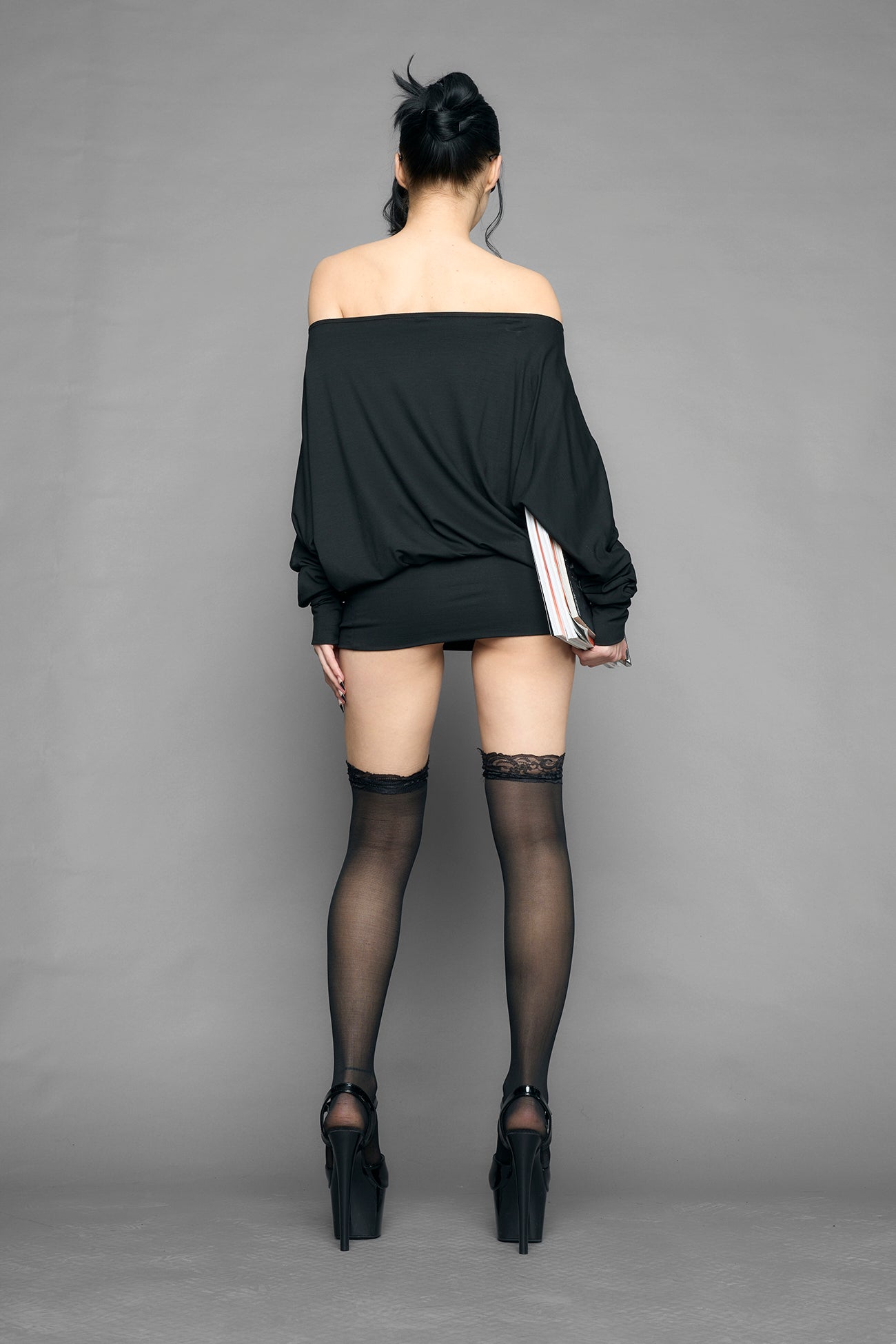 black off shoulder mini dress with long sleeves and statement text print worn by model studio ecommerce image